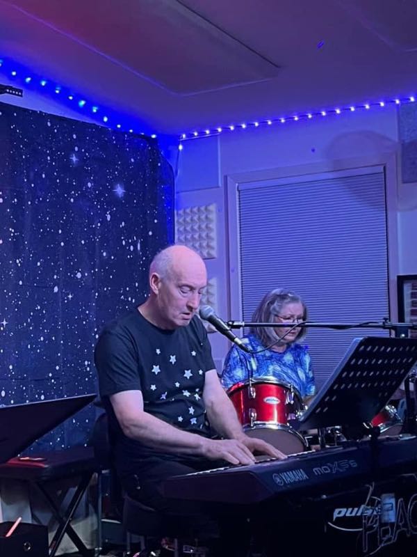 Phil and Myra performing on stage